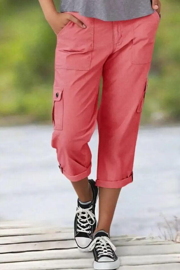 Mid-rise capri pants with a distressed hem and multiple pockets.