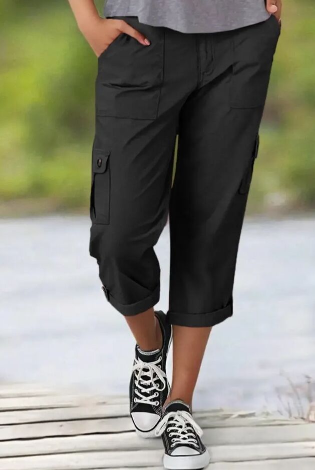 Mid-rise capri pants with a distressed hem and multiple pockets.
